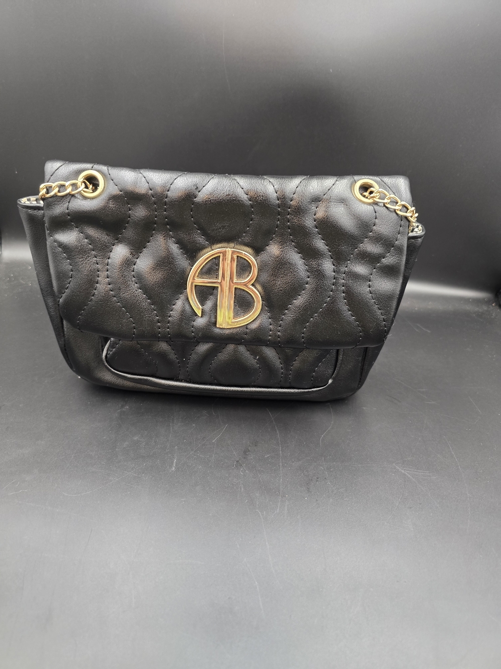 Black Quilted Shoulder Bag with Gold AB Emblem